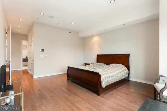 a bathroom with a sink vanity and toilet