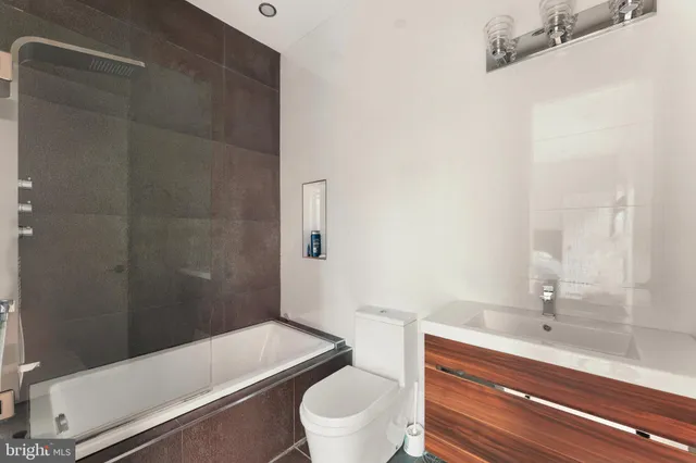 a bedroom with a bed and a chair