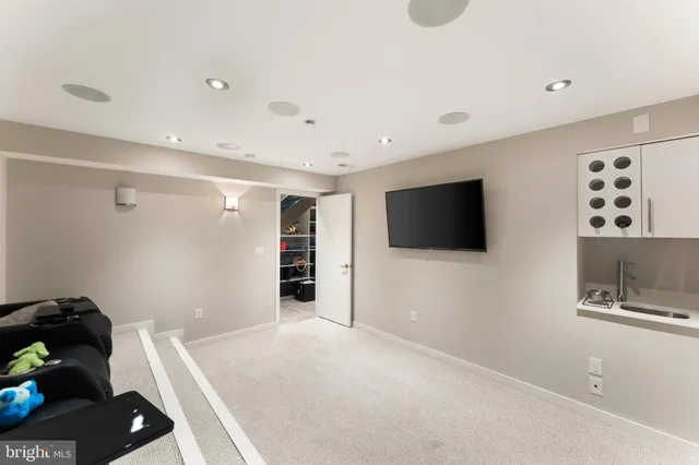 a bathroom with a sink toilet a mirror and shower