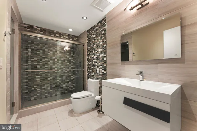 a balcony with furniture and a potted plant