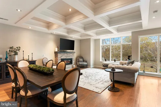 a living room with fireplace furniture and a flat screen tv