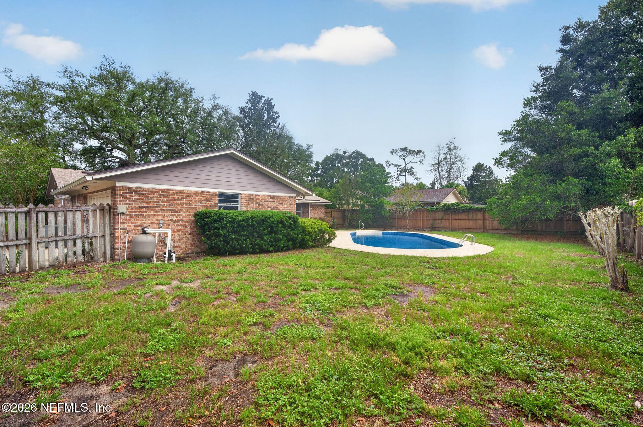138 Ridgefield Court Orange Park, FL 32065 - Photo 49 of 64 a backyard of a house with lots of green space