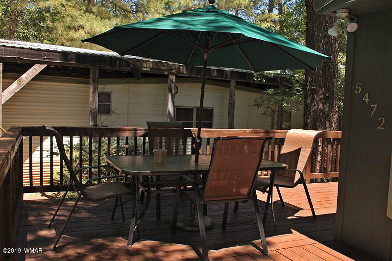 5472 North Blue Ridge Loop Pinetop, AZ 85935 - Photo 3 of 22 a patio with table and chairs