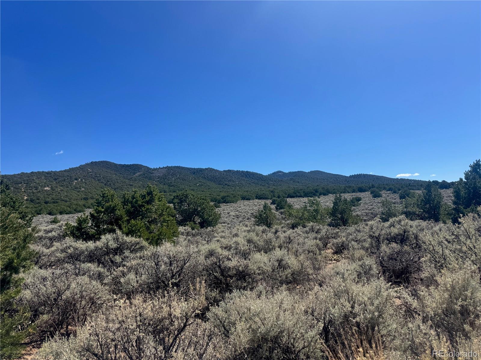 Lot 1275 Juarez Road Fort Garland, CO 81133 - Photo 9 of 14 a view of mountain with sunset