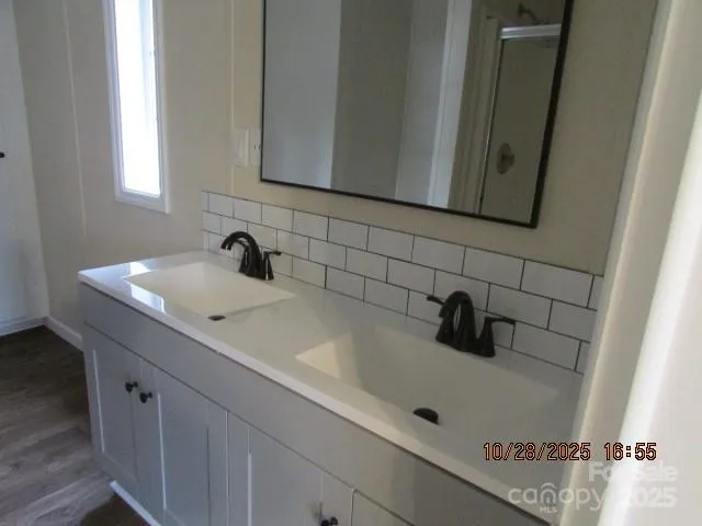 a bathroom with a sink and mirror