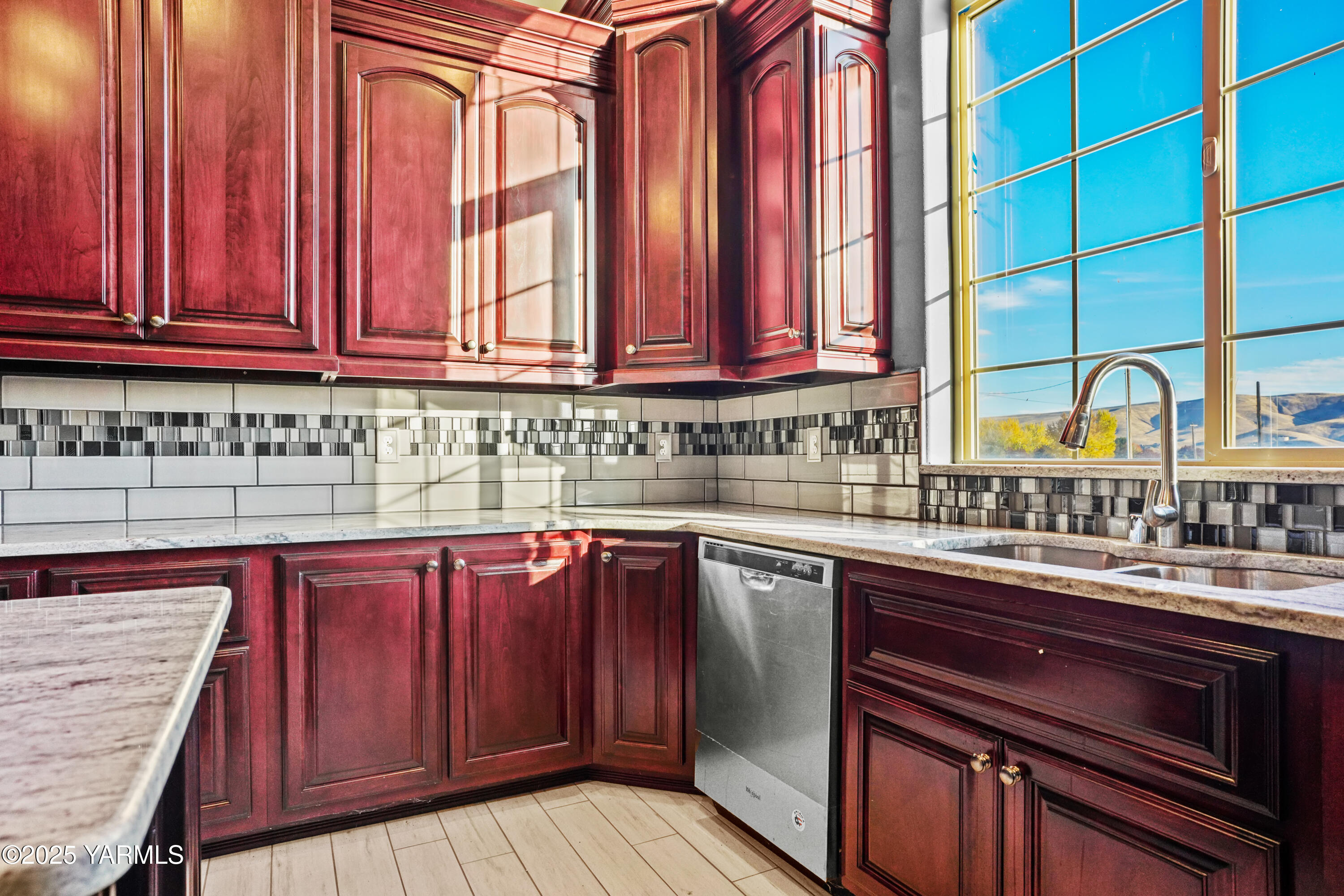 10002 North Wamba Road Prosser, WA 99350 - Photo 12 of 40 a kitchen with stainless steel appliances granite countertop a sink a stove and cabinets