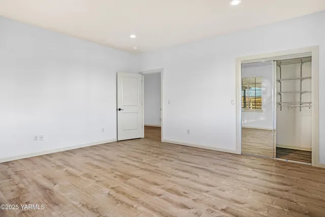 an empty room with windows closet and windows