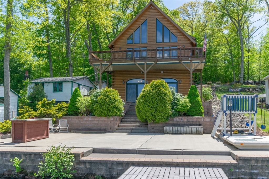 44 3rd Street Brimfield, MA 01010 - Photo 12 of 42 a front view of a house with a yard