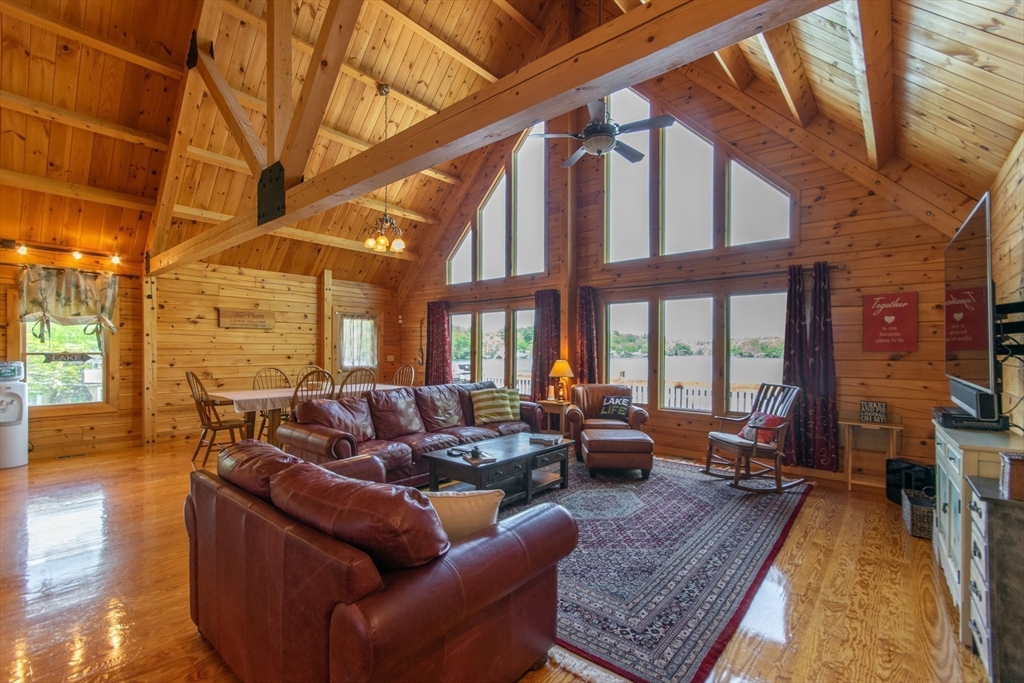 44 3rd Street Brimfield, MA 01010 - Photo 14 of 42 a living room with furniture a fireplace and a large window