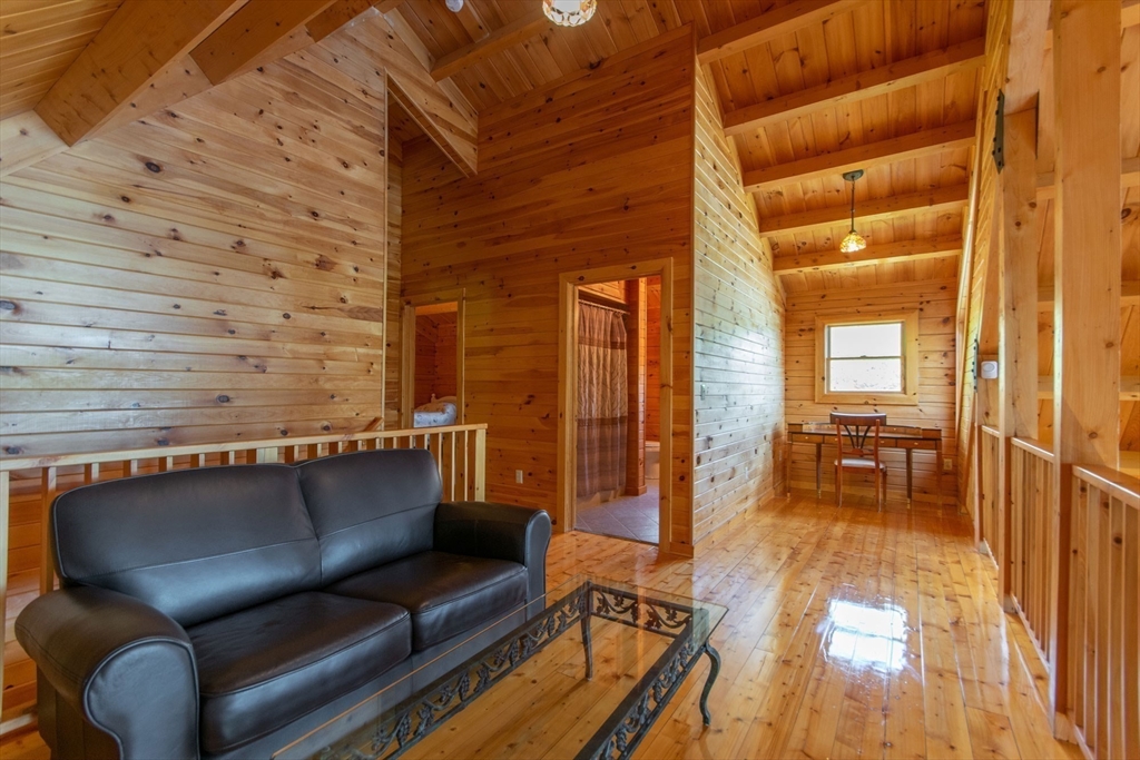 44 3rd Street Brimfield, MA 01010 - Photo 27 of 42 a view of a balcony with chairs and wooden floor