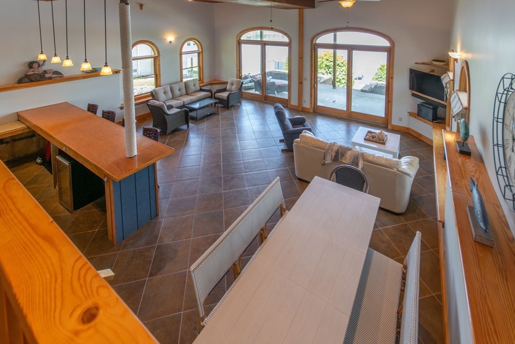 44 3rd Street Brimfield, MA 01010 - Photo 34 of 42 a living room with furniture a fireplace and a chandelier