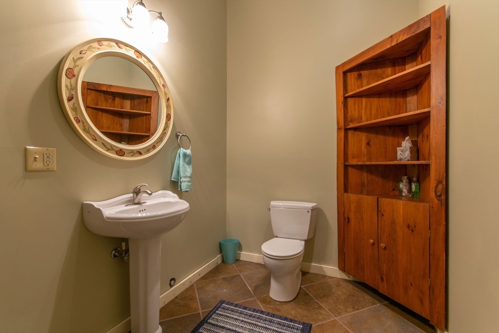 44 3rd Street Brimfield, MA 01010 - Photo 38 of 42 a bathroom with a sink toilet and a mirror
