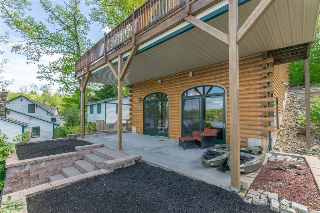 44 3rd Street Brimfield, MA 01010 - Photo 10 of 42 a view of a house with backyard porch and sitting area