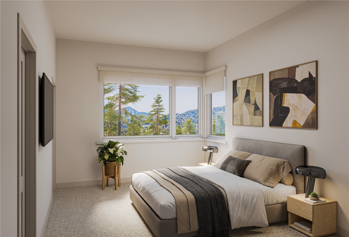620 Montezuma Road, Unit B1 Keystone, CO 80435 - Photo 3 of 20 a bedroom with a bed and a painting on the wall