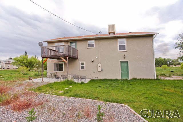 579 29 Road Grand Junction, CO 81501 - Photo 12 of 40 a view of a house with a yard