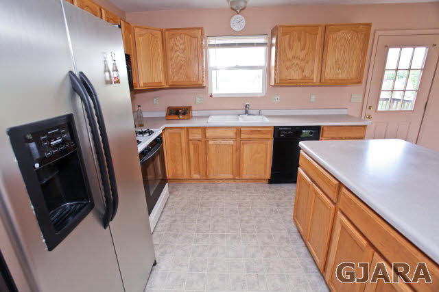 579 29 Road Grand Junction, CO 81501 - Photo 26 of 40 a kitchen with stainless steel appliances granite countertop a sink stove and refrigerator