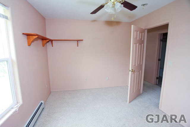 579 29 Road Grand Junction, CO 81501 - Photo 30 of 40 an empty room with a ceiling fan and window