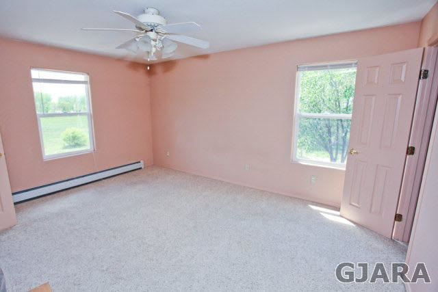 579 29 Road Grand Junction, CO 81501 - Photo 32 of 40 an empty room with windows and fan