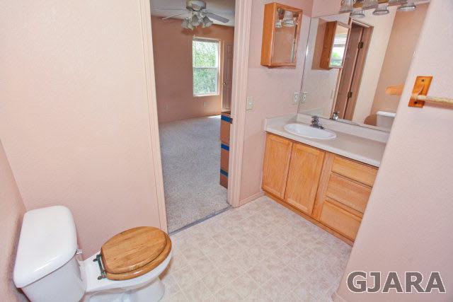 579 29 Road Grand Junction, CO 81501 - Photo 33 of 40 a bathroom with a granite countertop sink and a mirror