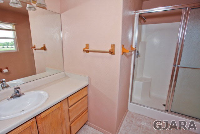 579 29 Road Grand Junction, CO 81501 - Photo 34 of 40 a bathroom with a sink and a mirror