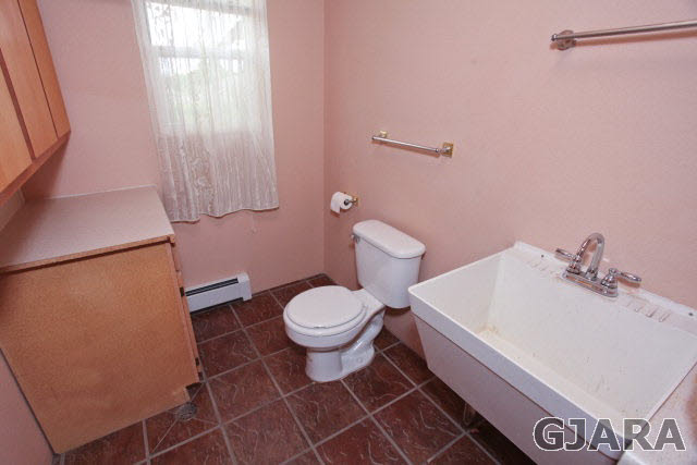 579 29 Road Grand Junction, CO 81501 - Photo 40 of 40 a bathroom with a toilet sink and mirror