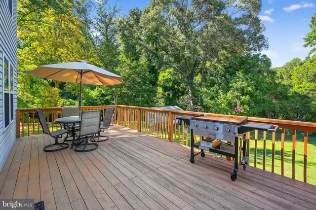 a view of roof deck with furniture