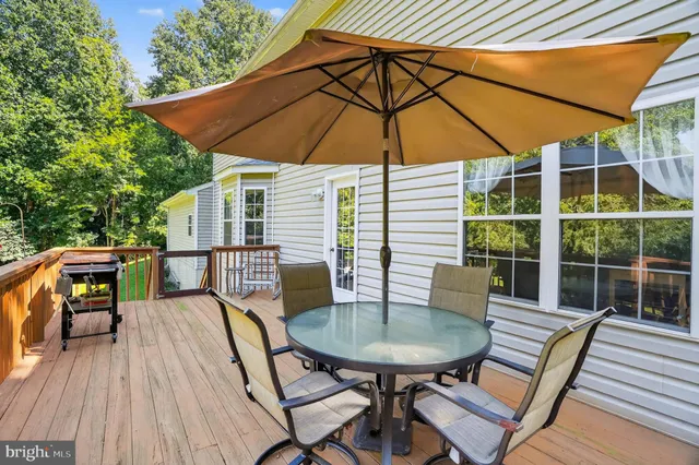 a balcony view with a seating space