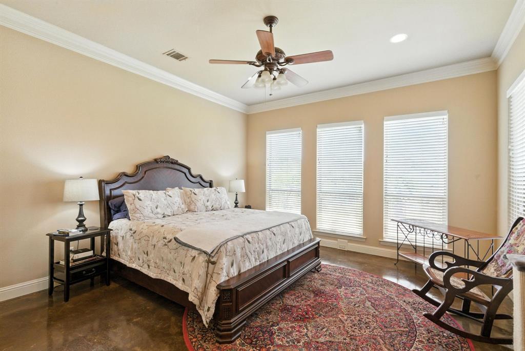 680 Sunfish Point Bluff Dale, TX 76433 - Photo 16 of 40 a bedroom with a bed and a chandelier