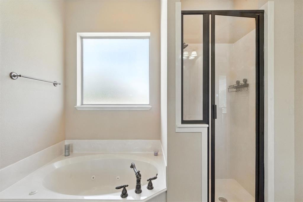 680 Sunfish Point Bluff Dale, TX 76433 - Photo 19 of 40 a white bath tub sitting next to a shower