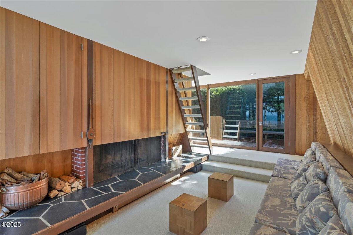 110 Ridge Crest Road Gleneden Beach, OR 97388 - Photo 20 of 72 a living room with furniture a window and a fireplace