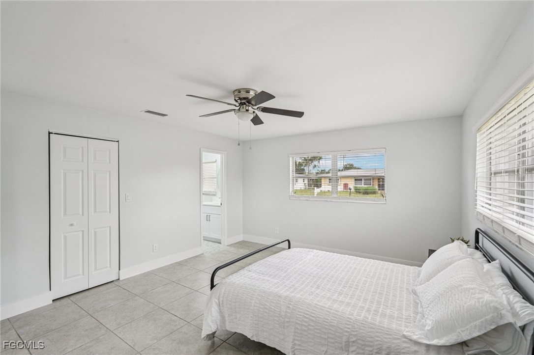 2342 Aldridge Avenue Fort Myers, FL 33907 - Photo 14 of 21 a bedroom with a bed and a chandelier