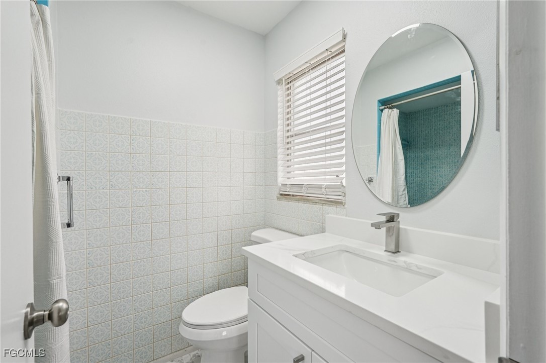 2342 Aldridge Avenue Fort Myers, FL 33907 - Photo 16 of 21 a bathroom with a sink a toilet and shower