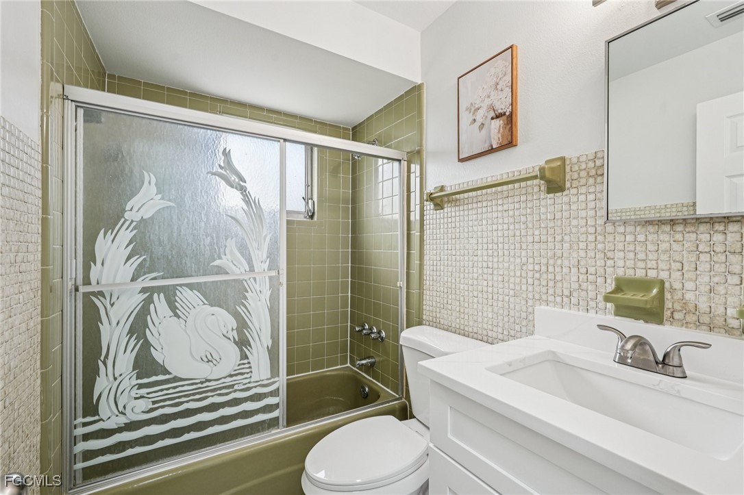 2342 Aldridge Avenue Fort Myers, FL 33907 - Photo 17 of 21 a bathroom with a sink a toilet and shower