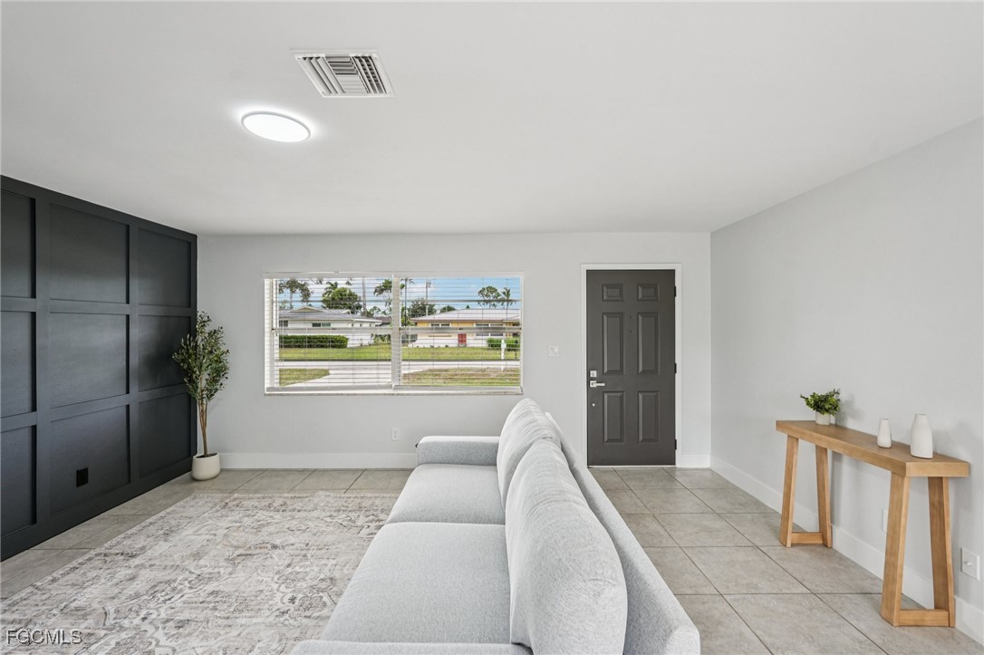 2342 Aldridge Avenue Fort Myers, FL 33907 - Photo 3 of 21 a bedroom with a bed and a large window