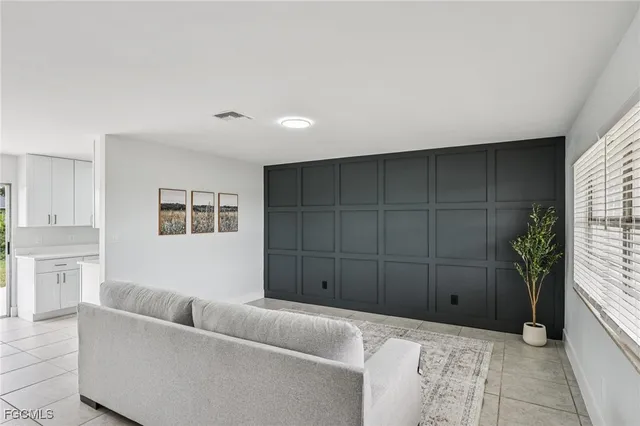 a living room with furniture and window