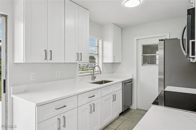 a kitchen with a sink and cabinets