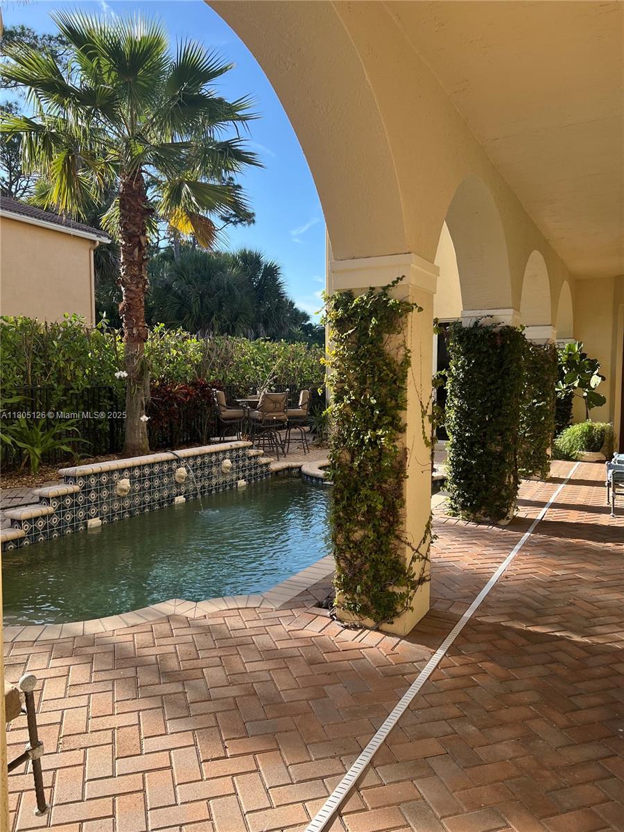 9130 Nugent Trail West Palm Beach, FL 33411 - Photo 14 of 20 a view of a pathway both side of building