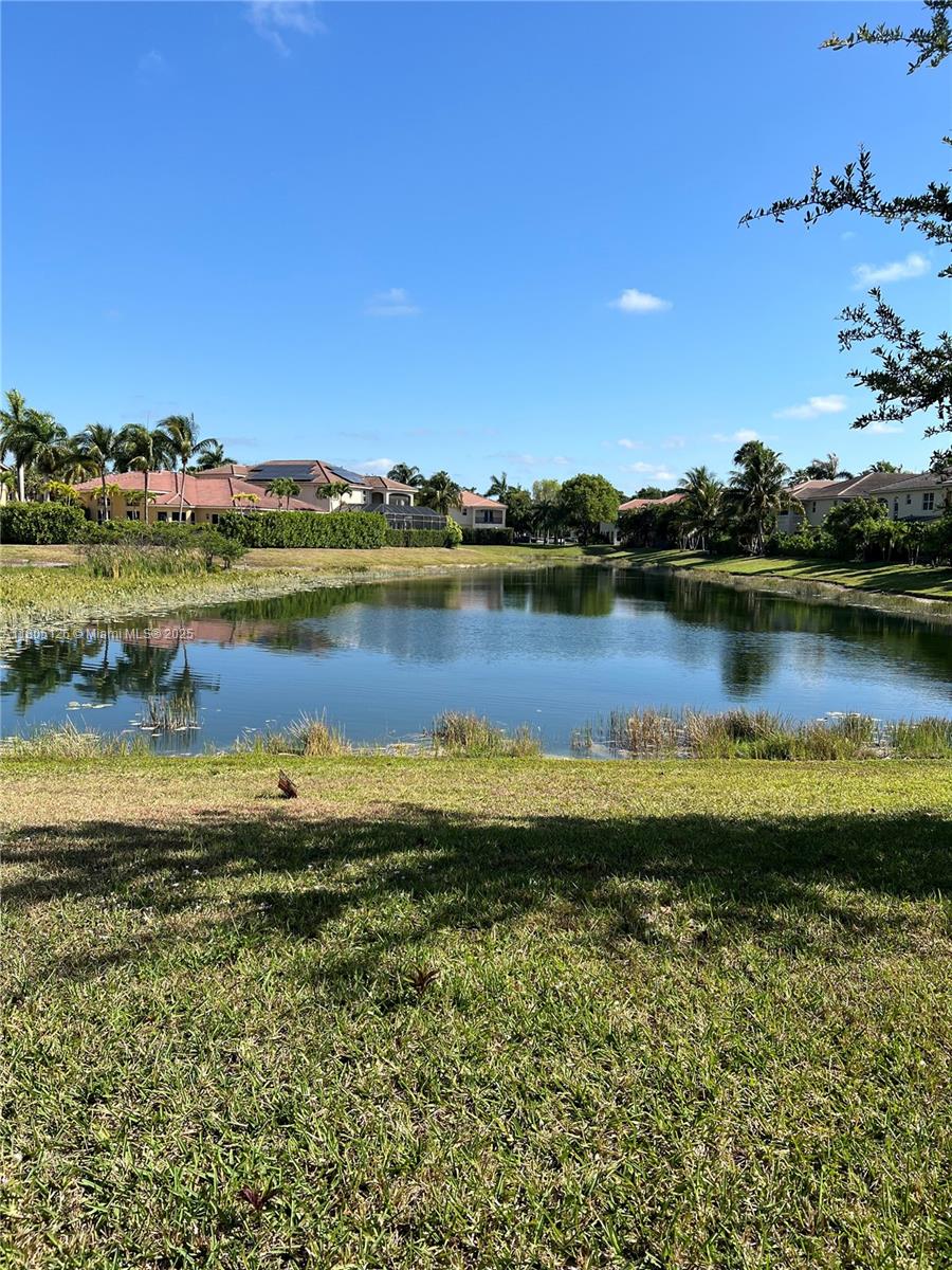 9130 Nugent Trail West Palm Beach, FL 33411 - Photo 15 of 20 a view of a lake with houses in the back