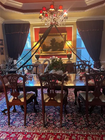 a view of a chairs and table in a backyard