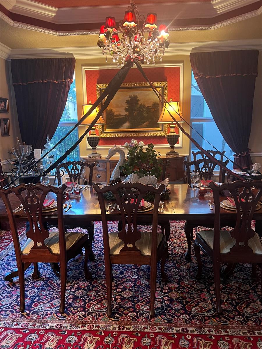 9130 Nugent Trail West Palm Beach, FL 33411 - Photo 3 of 20 a view of a chairs and table in a backyard