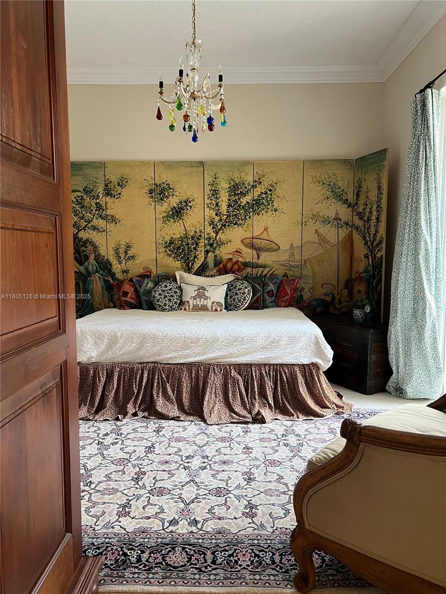 9130 Nugent Trail West Palm Beach, FL 33411 - Photo 9 of 20 a bedroom with a bed and window