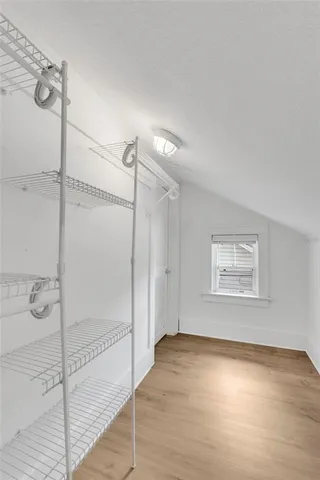 a room with gym equipment and a window
