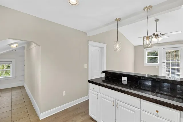 a granite counter top a window and a sink
