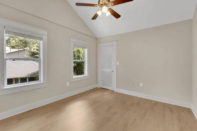 a view of an empty room with a window