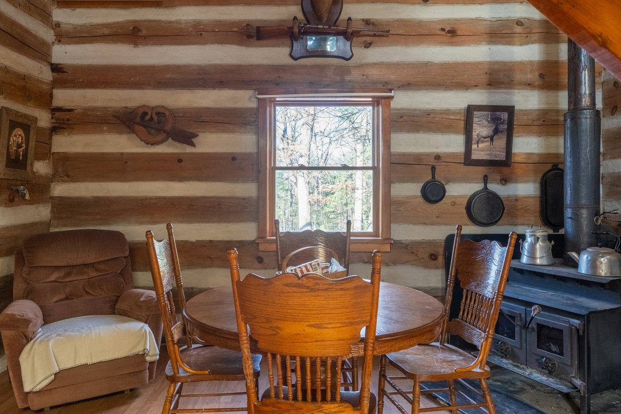 800 Cove Mountain Road Mathias, WV 26812 - Photo 13 of 74 a view of a dining room with furniture and chandelier