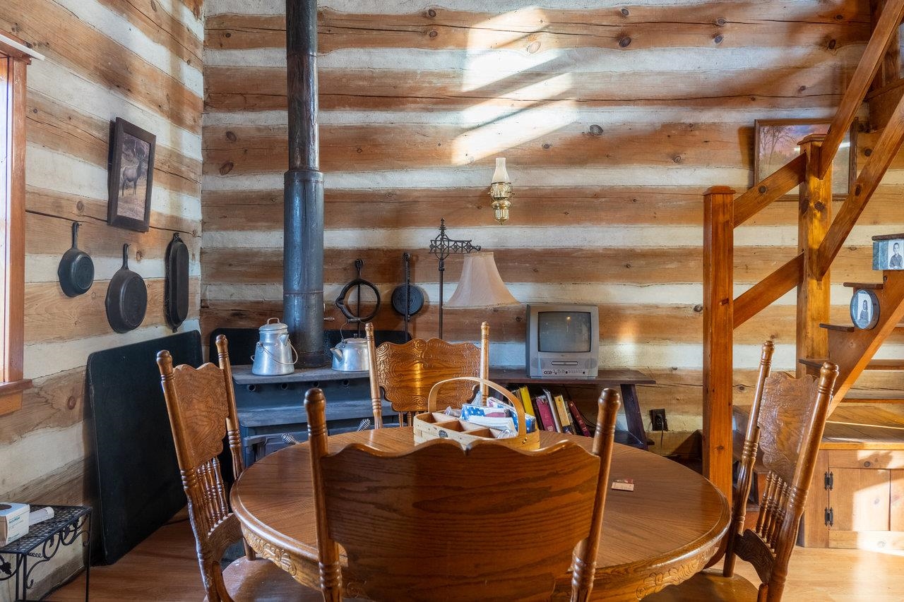800 Cove Mountain Road Mathias, WV 26812 - Photo 16 of 74 a view of a dining room with furniture one side kitchen view