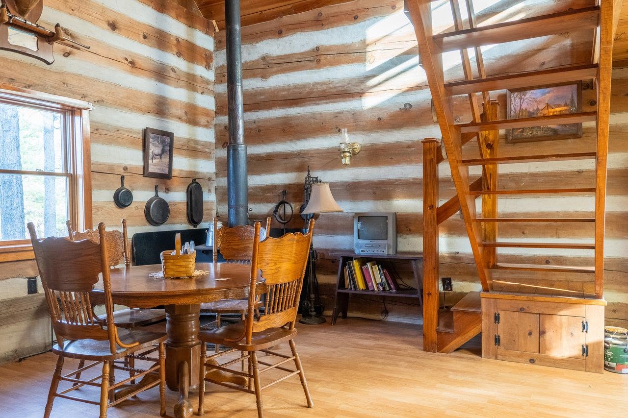 800 Cove Mountain Road Mathias, WV 26812 - Photo 17 of 74 a dining room with furniture and wooden floor