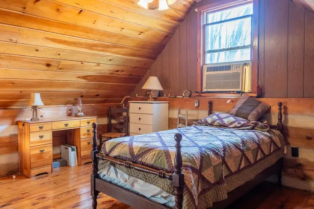 a bathroom with a sink vanity mirror and toilet