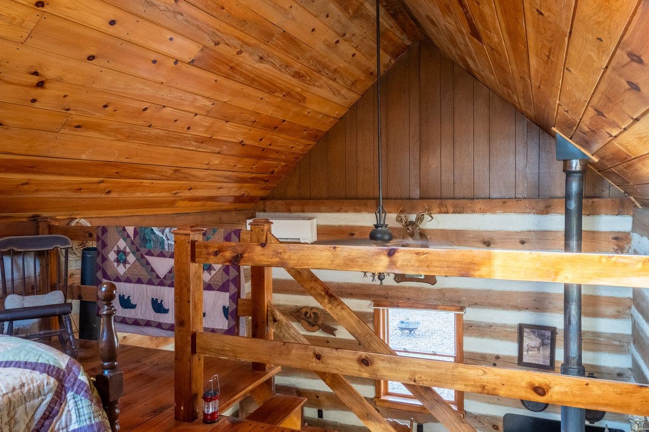 800 Cove Mountain Road Mathias, WV 26812 - Photo 21 of 74 a kitchen with stainless steel appliances kitchen island granite countertop a sink and cabinets