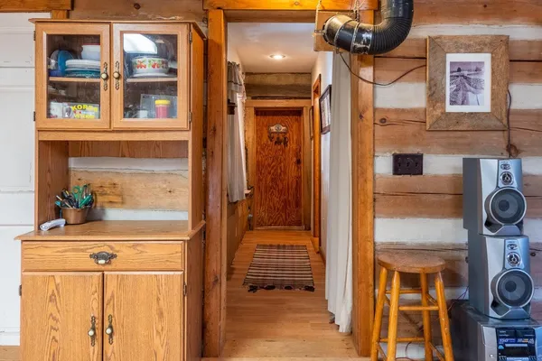 a view of a dinning table and chairs on the deck
